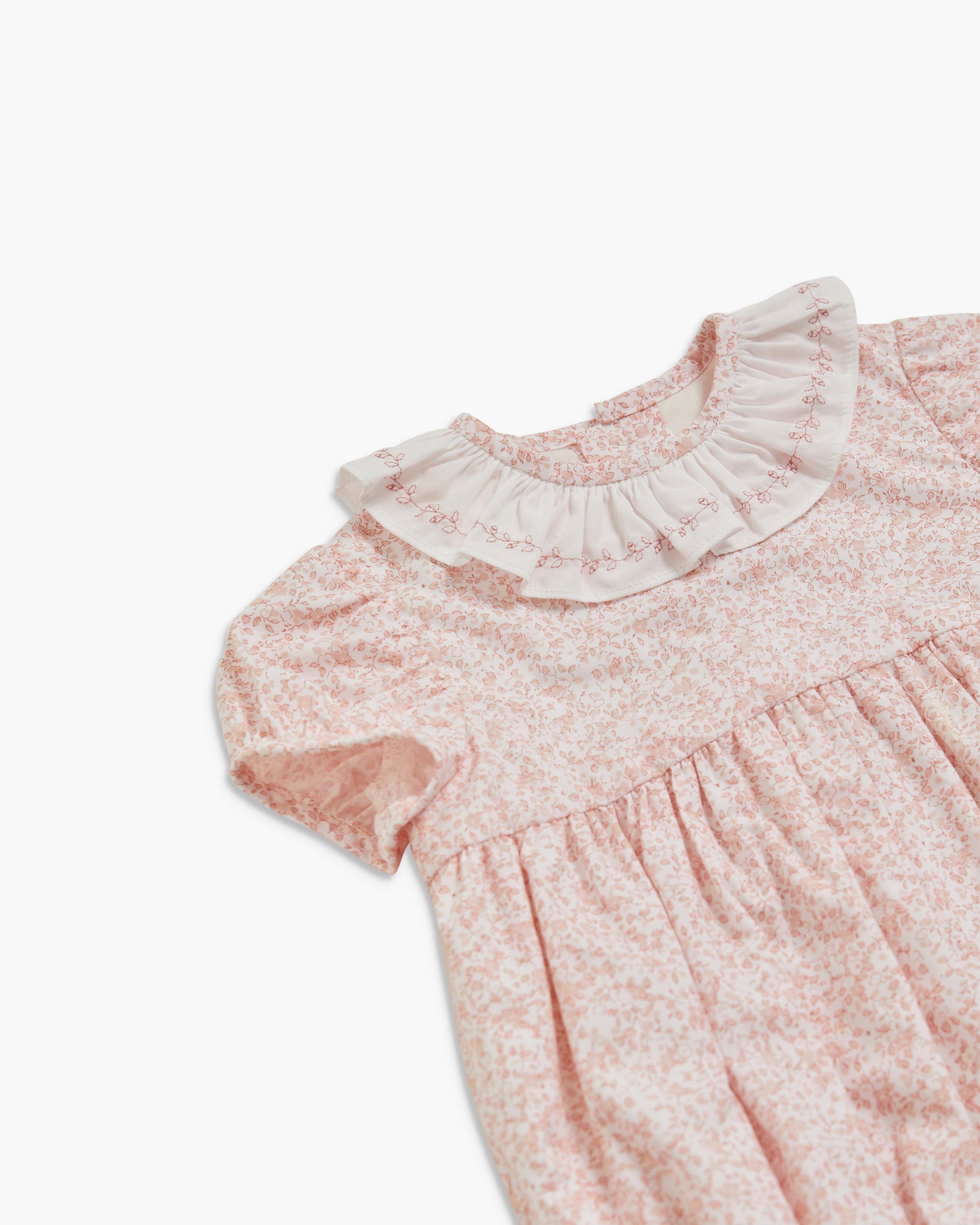 Floral dress with ruffled collar on a white background