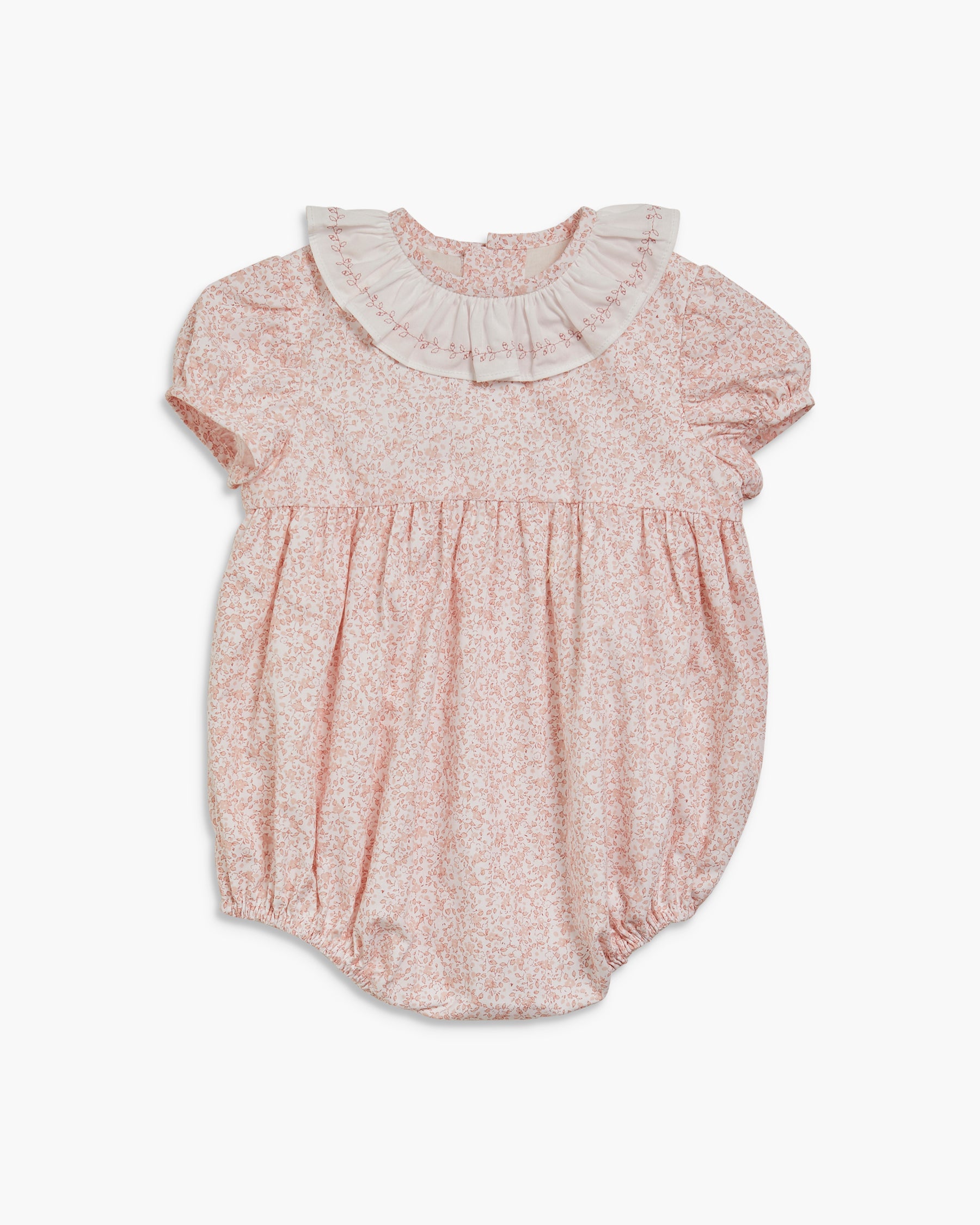 Pink floral baby romper with ruffled collar on a white background