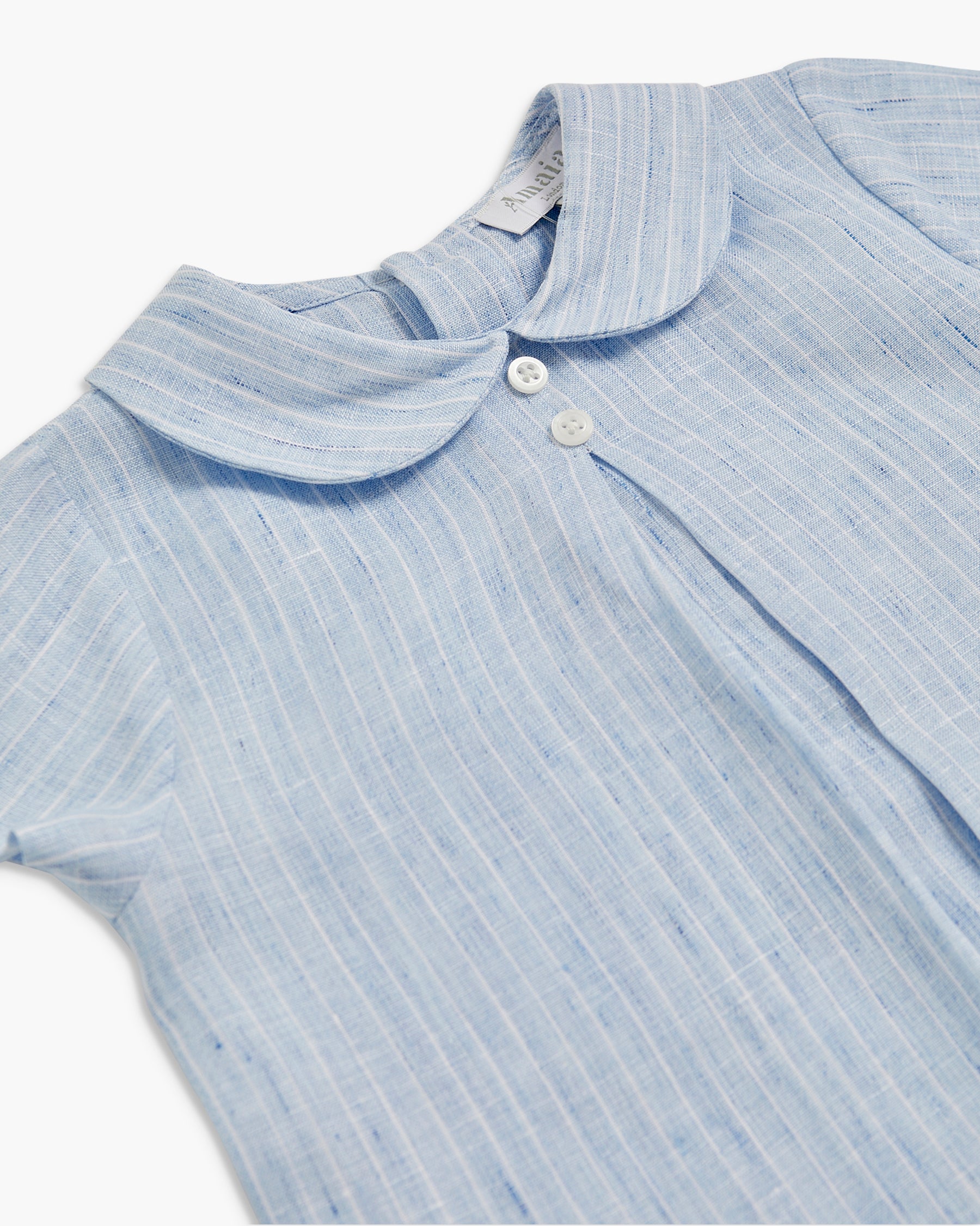 Light blue striped shirt with collar and buttons on a white background
