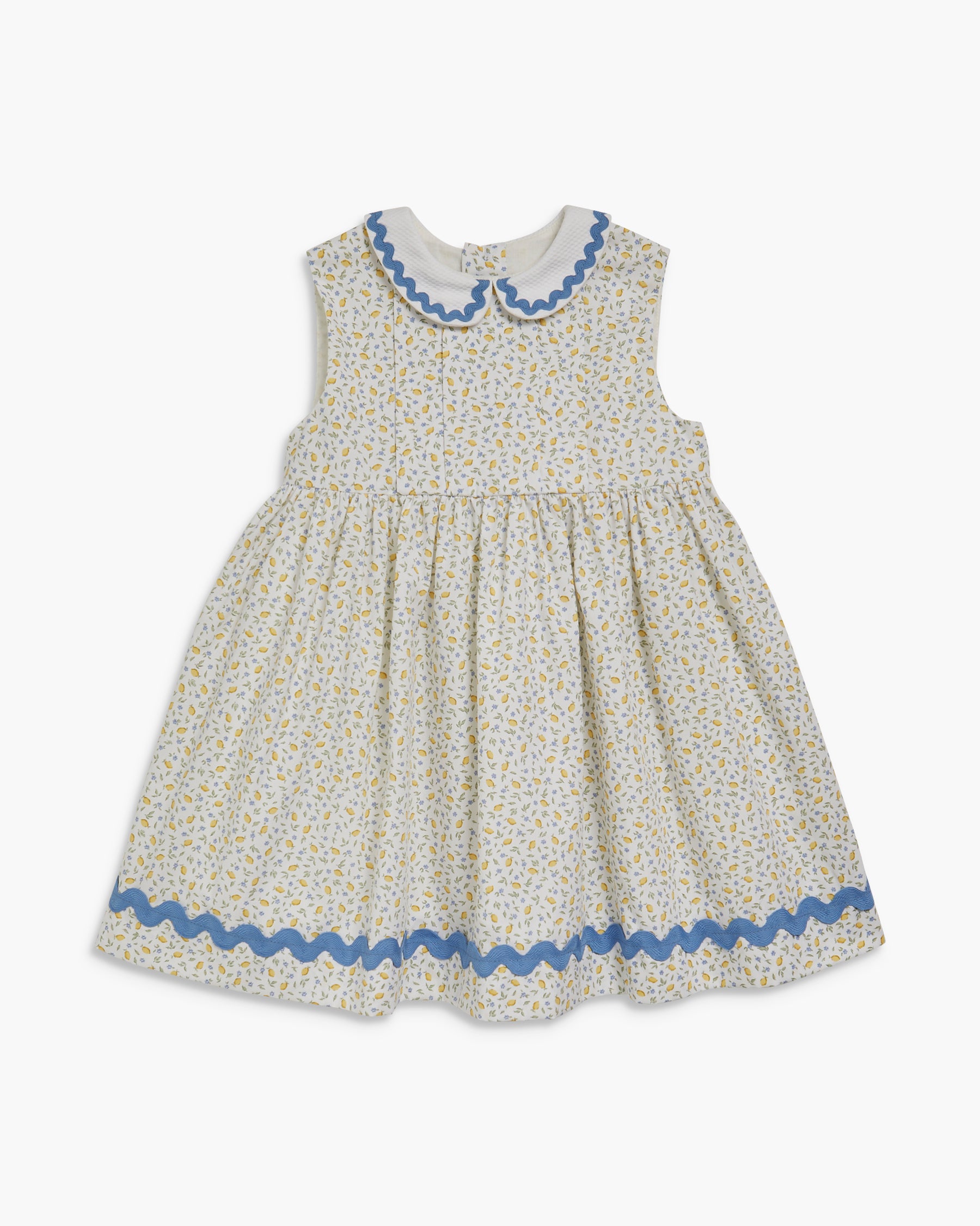 Children's dress with floral pattern and blue trim on a white background