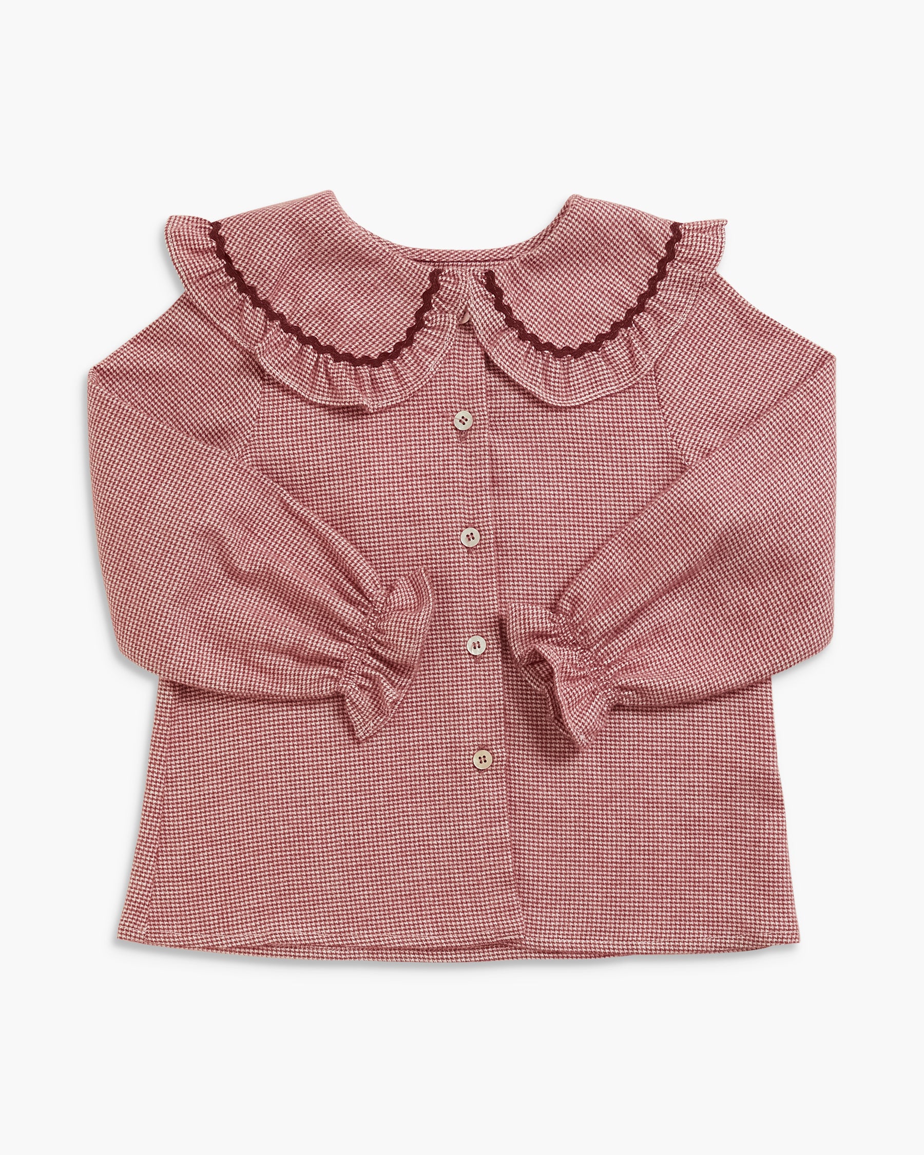 A long-sleeve button-front blouse for toddlers, featuring a small-scale checkered pattern in dusty rose and white, a large ruffled Peter Pan collar with dark trim, and gathered elbow-length sleeves with ruffled cuffs.