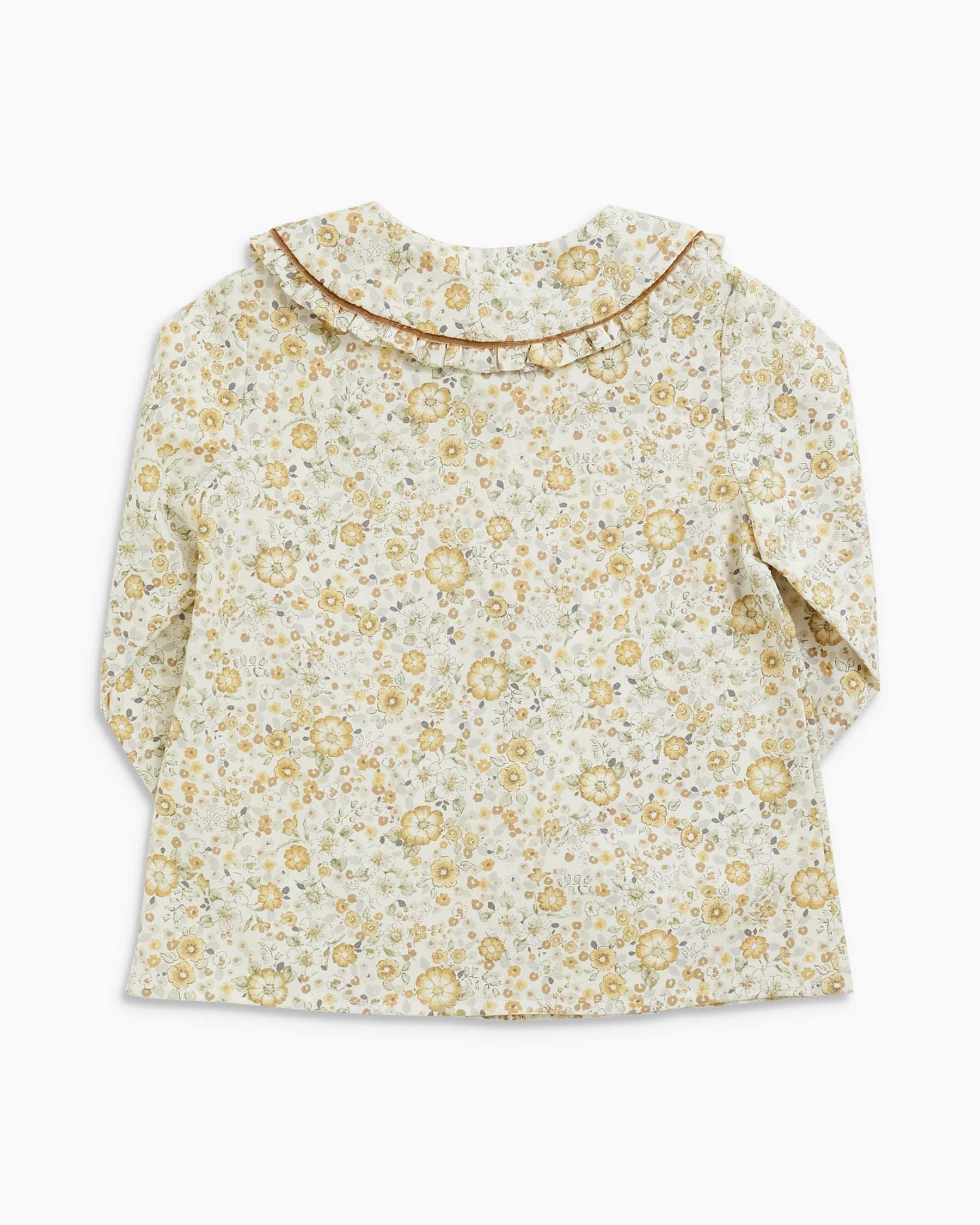 A long-sleeve blouse for toddlers or young children, featuring a delicate yellow and green floral print on a cream background, with a ruffled collar trimmed in gold-toned piping.
