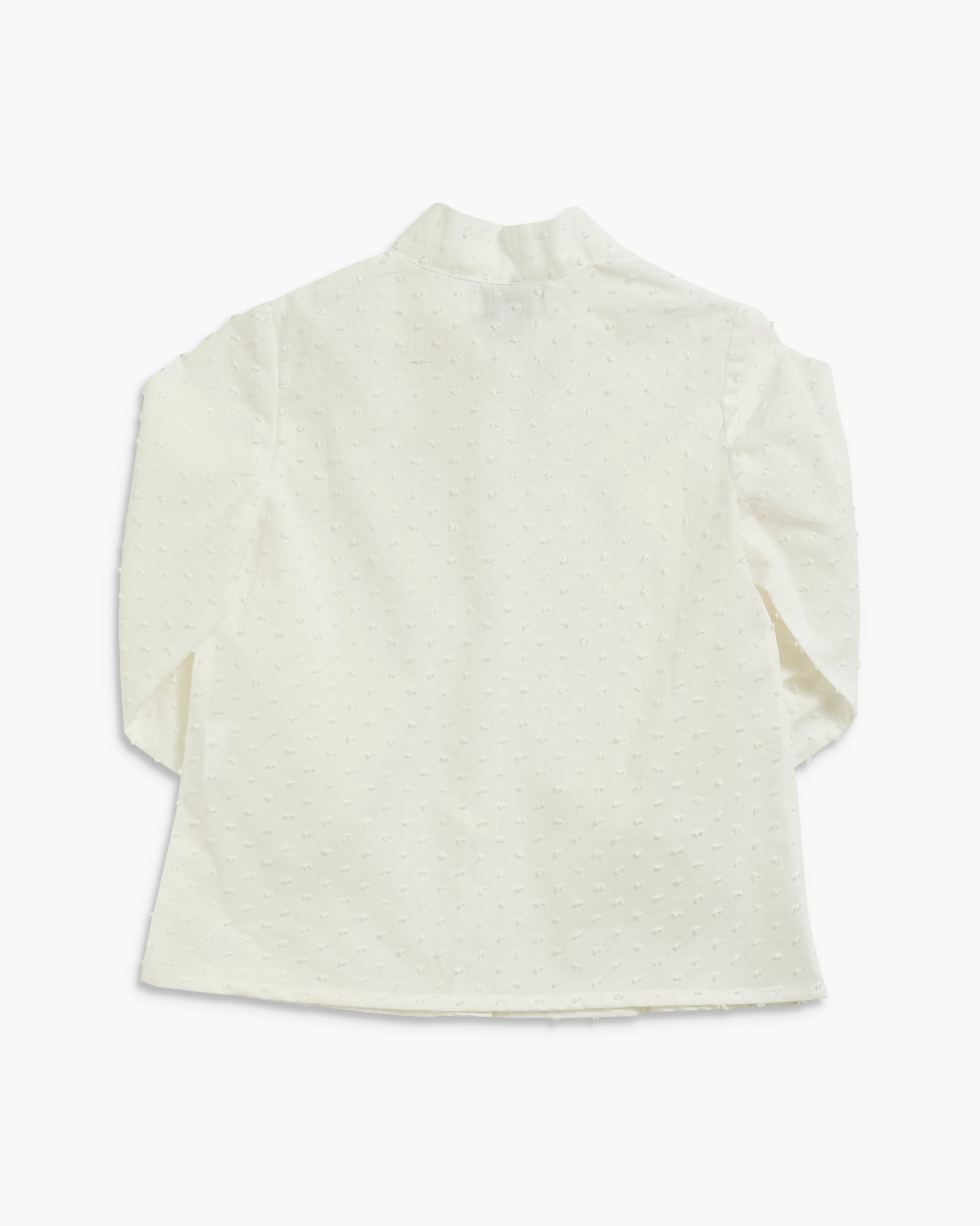 An off-white textured long-sleeve top with a mock neck, shown from the back on a light gray background.