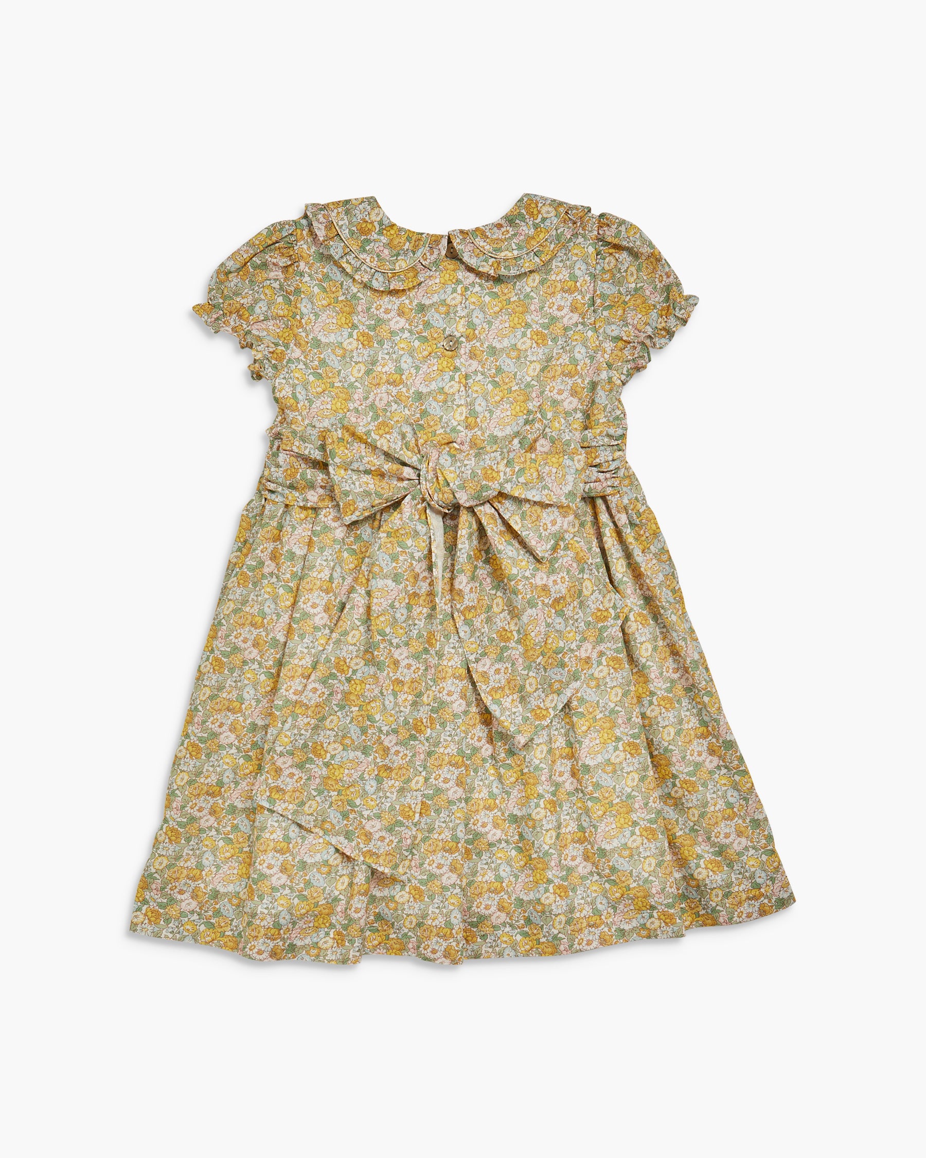 Yellow floral dress with a bow on a white background
