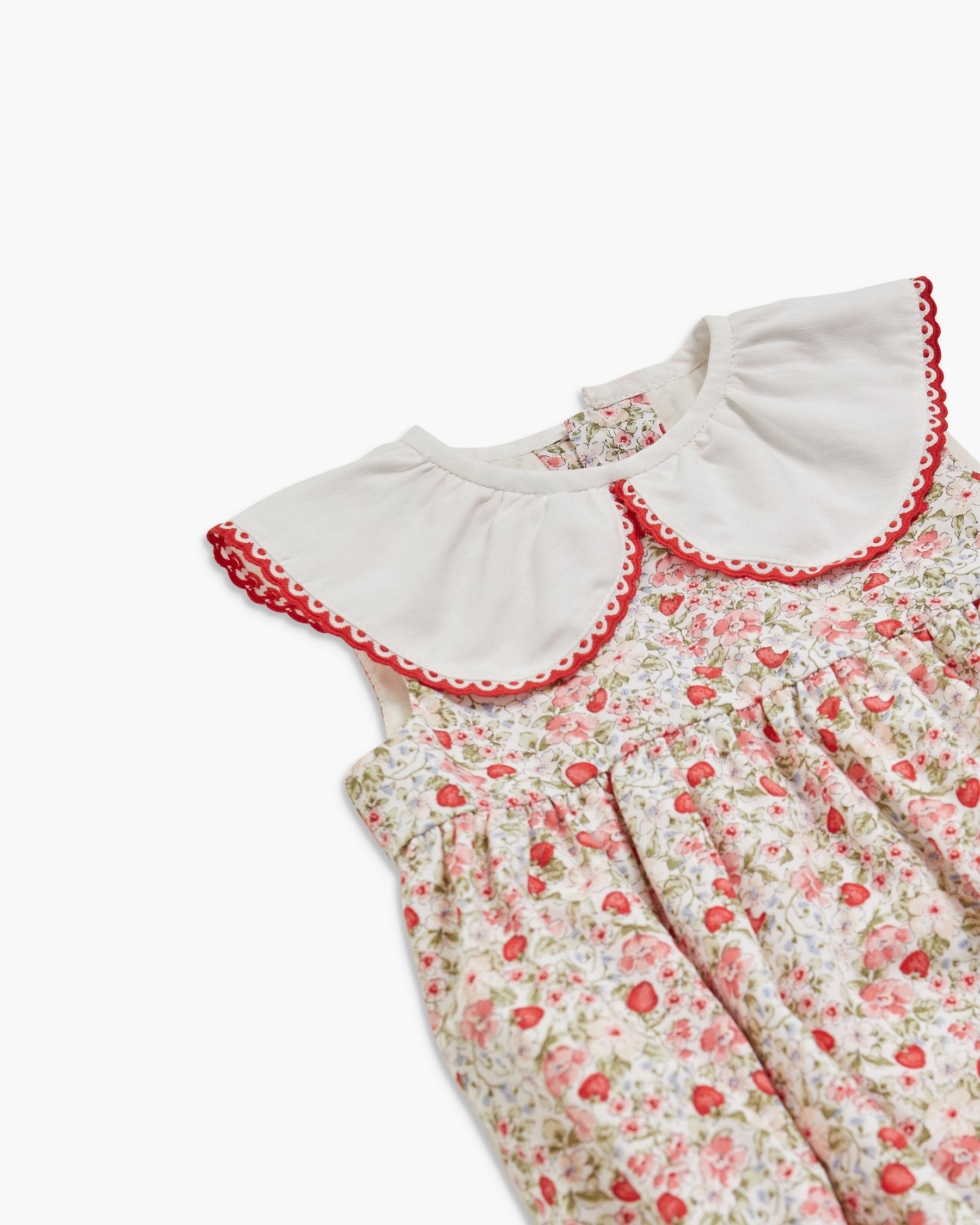 Floral dress with ruffled collar on a white background