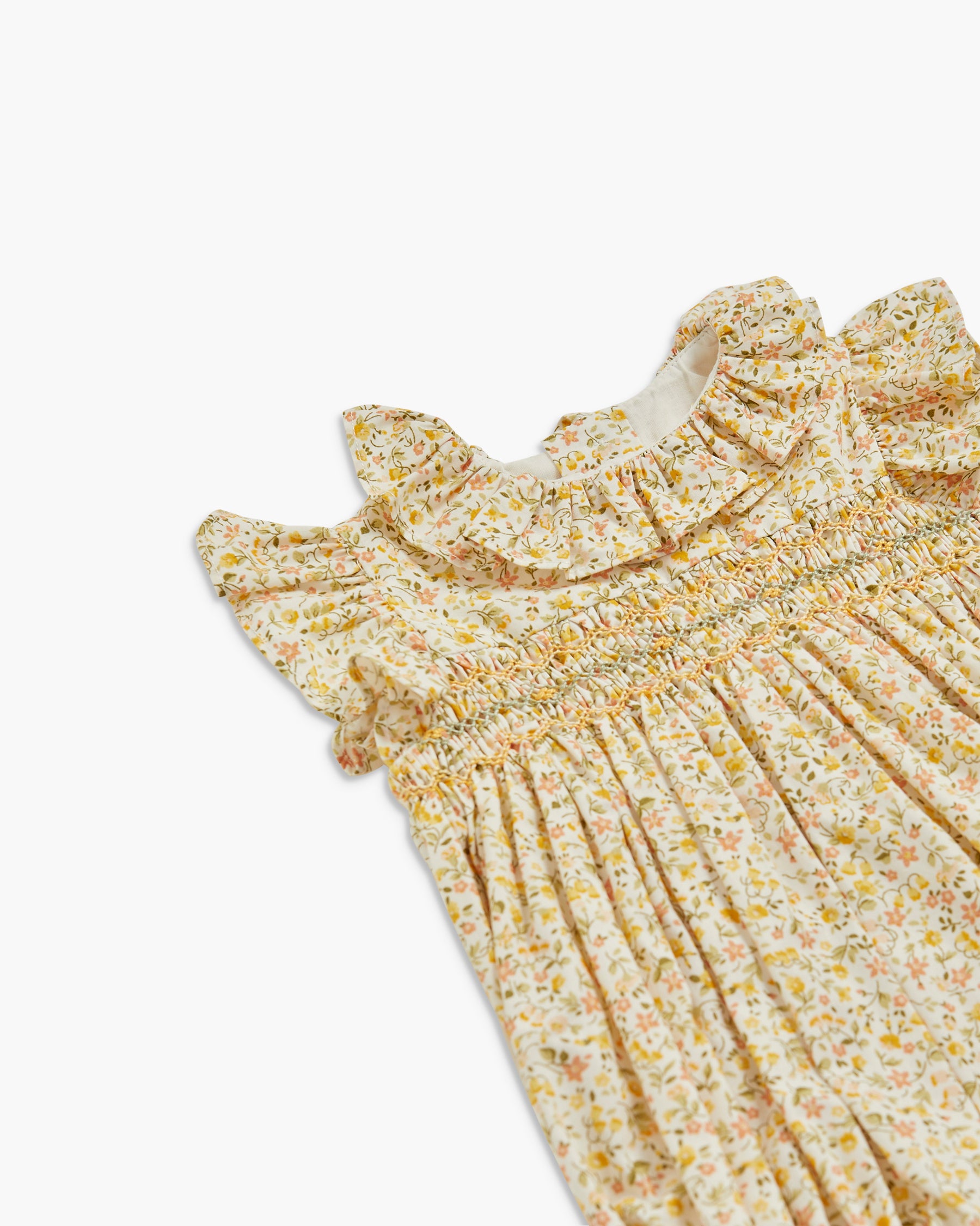 Floral dress with ruffled collar on a white background