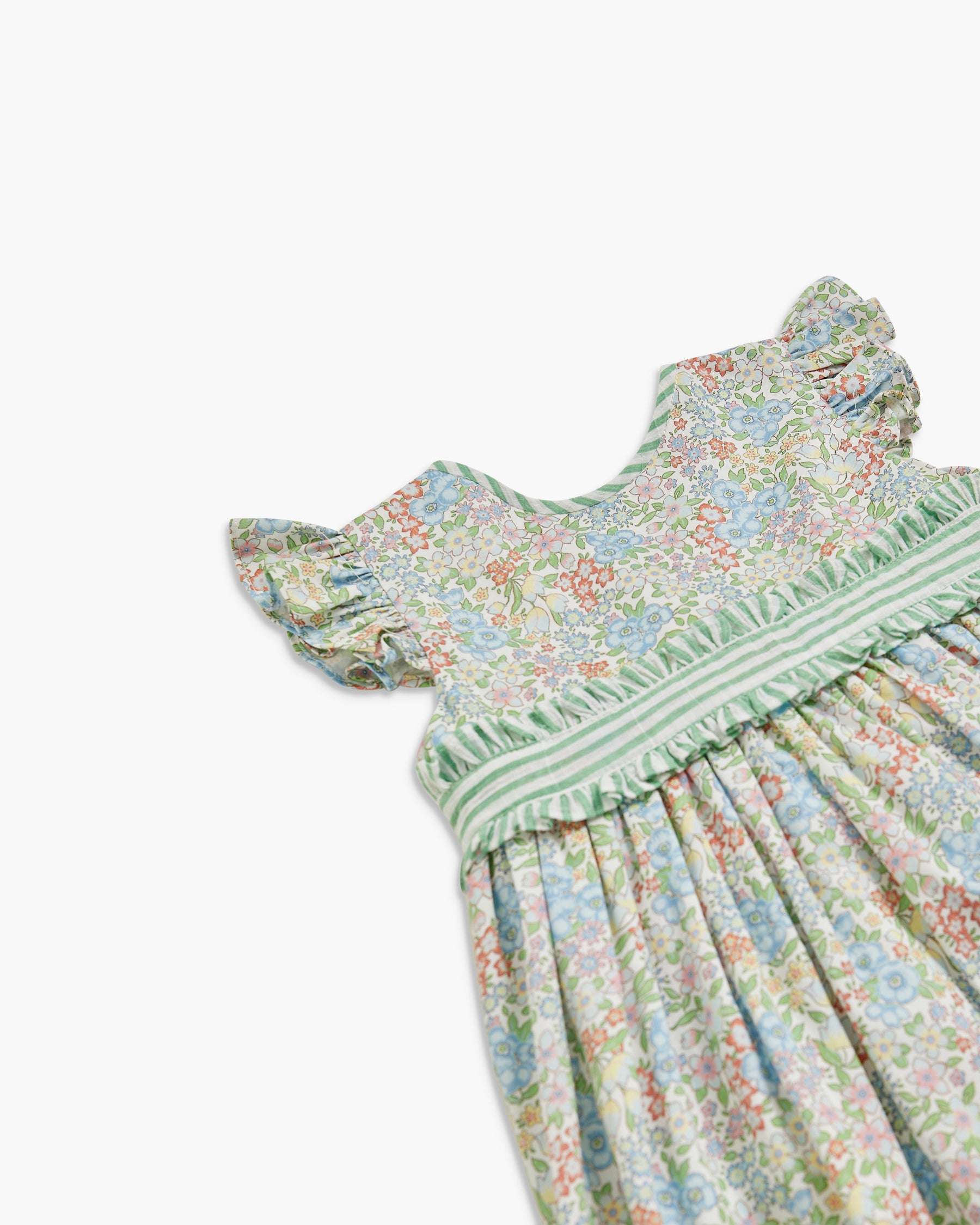 Floral dress with green trim on a white background