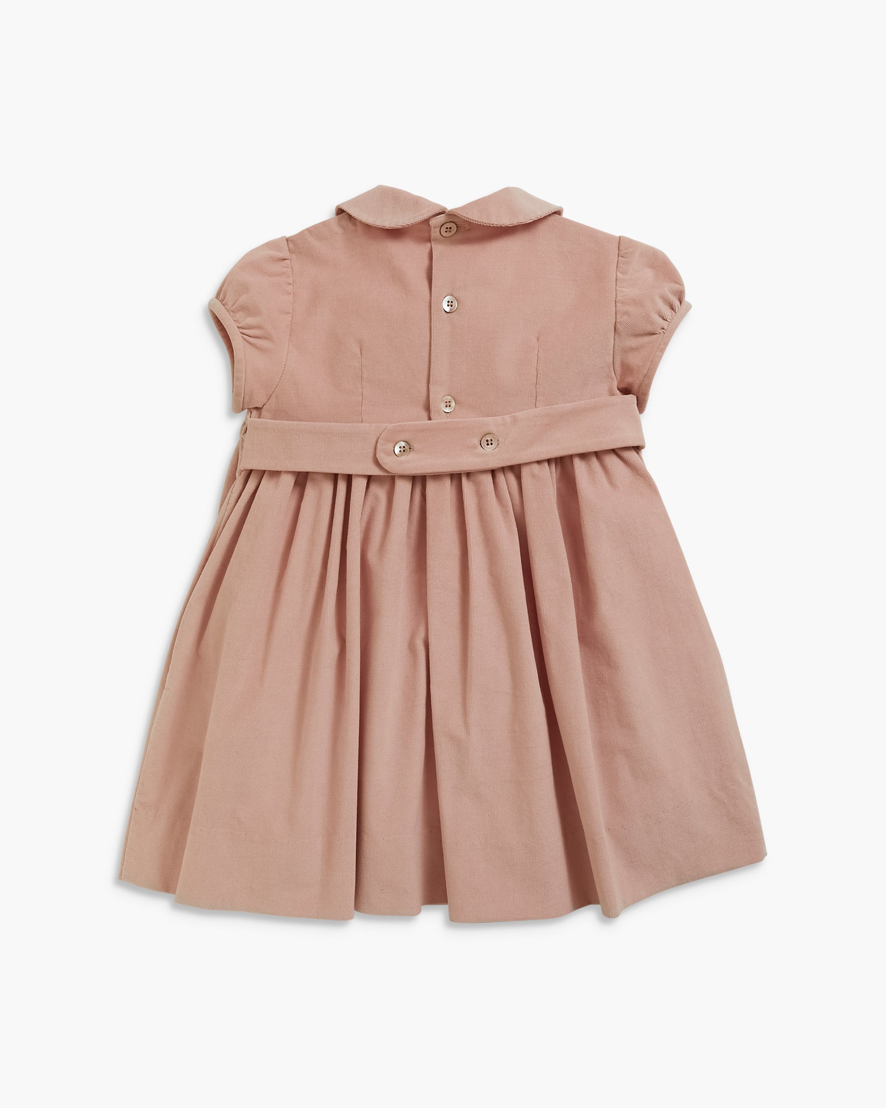 A dusty rose pink toddler dress with a Peter Pan collar, short puff sleeves, a buttoned front, and a matching fabric waist belt with snap buttons, shown against a plain white background.