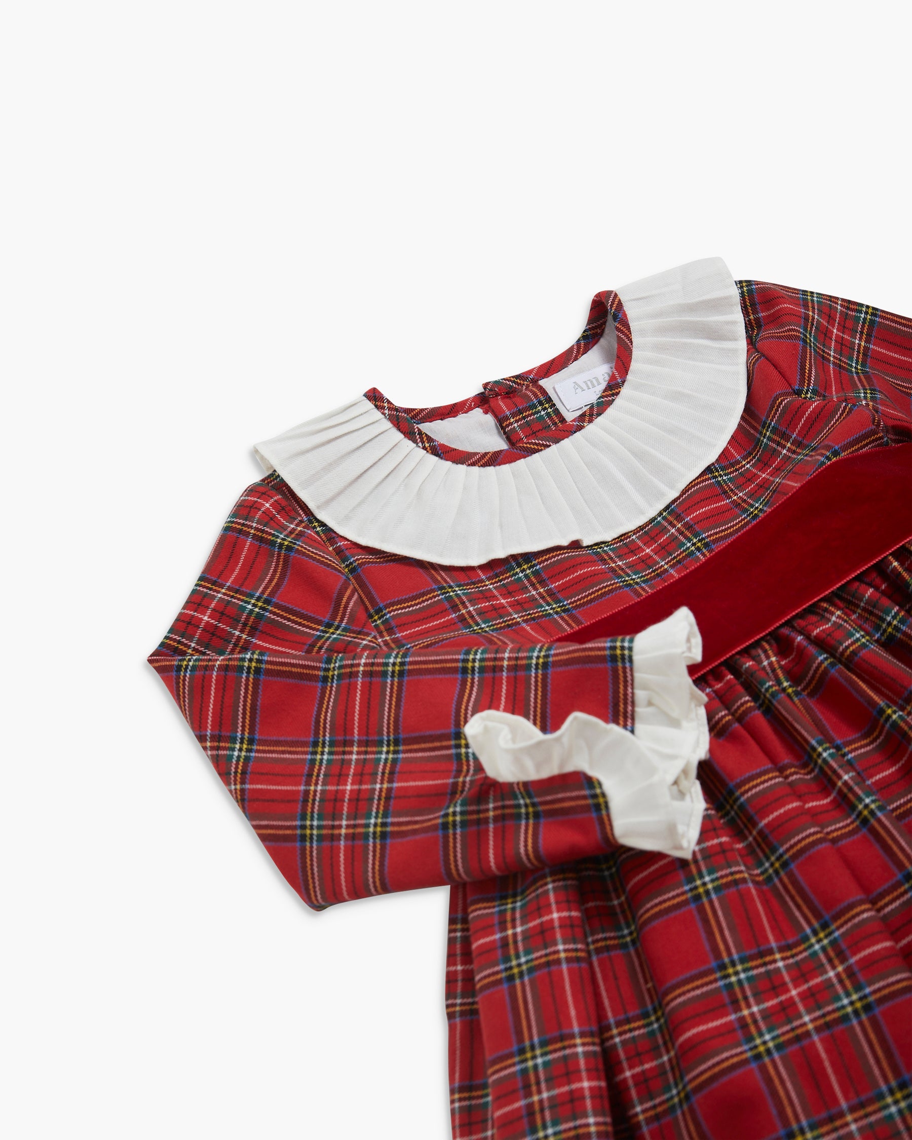 Red plaid dress with white collar and cuffs on a white background