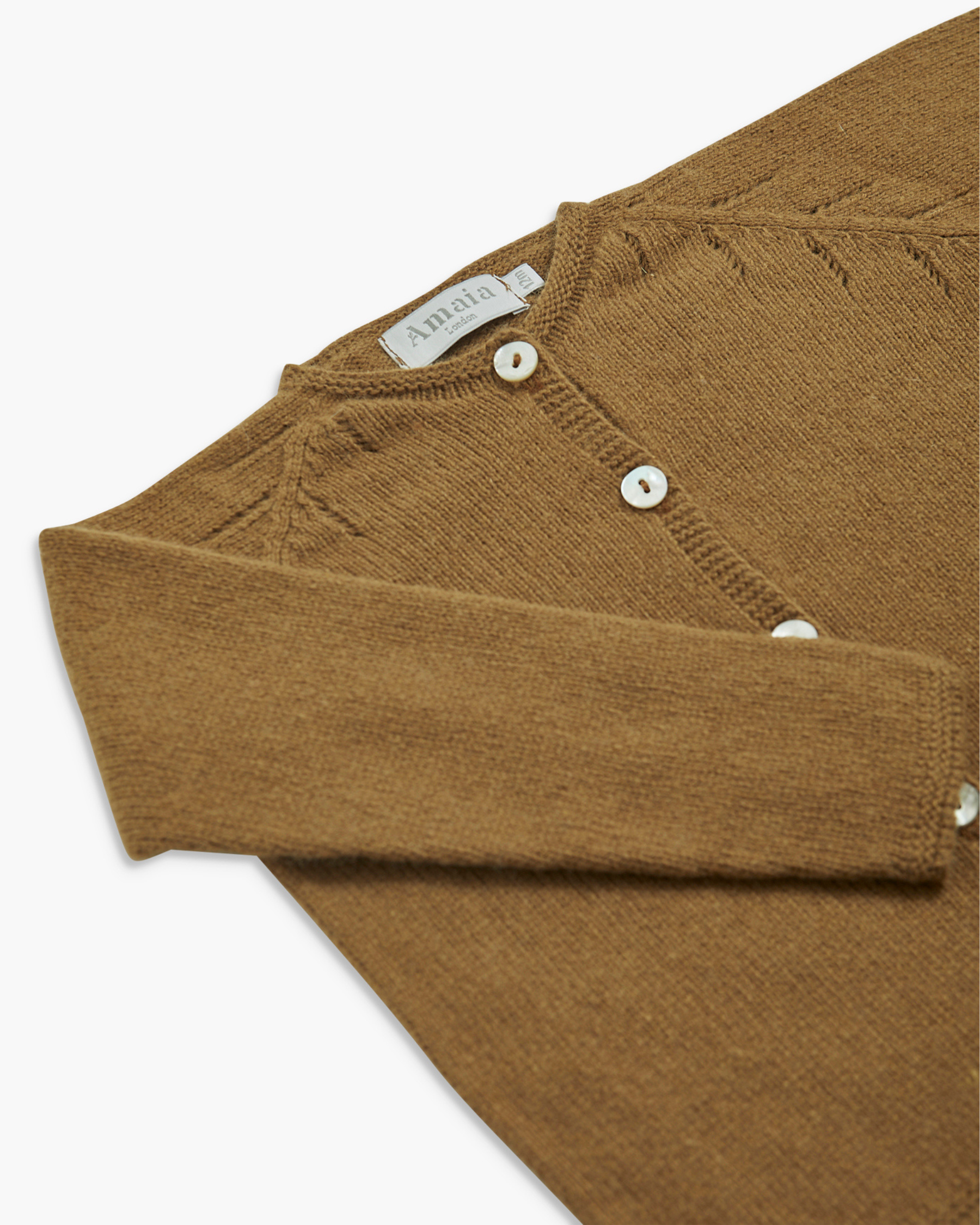 Brown knitted cardigan with button details on a white background