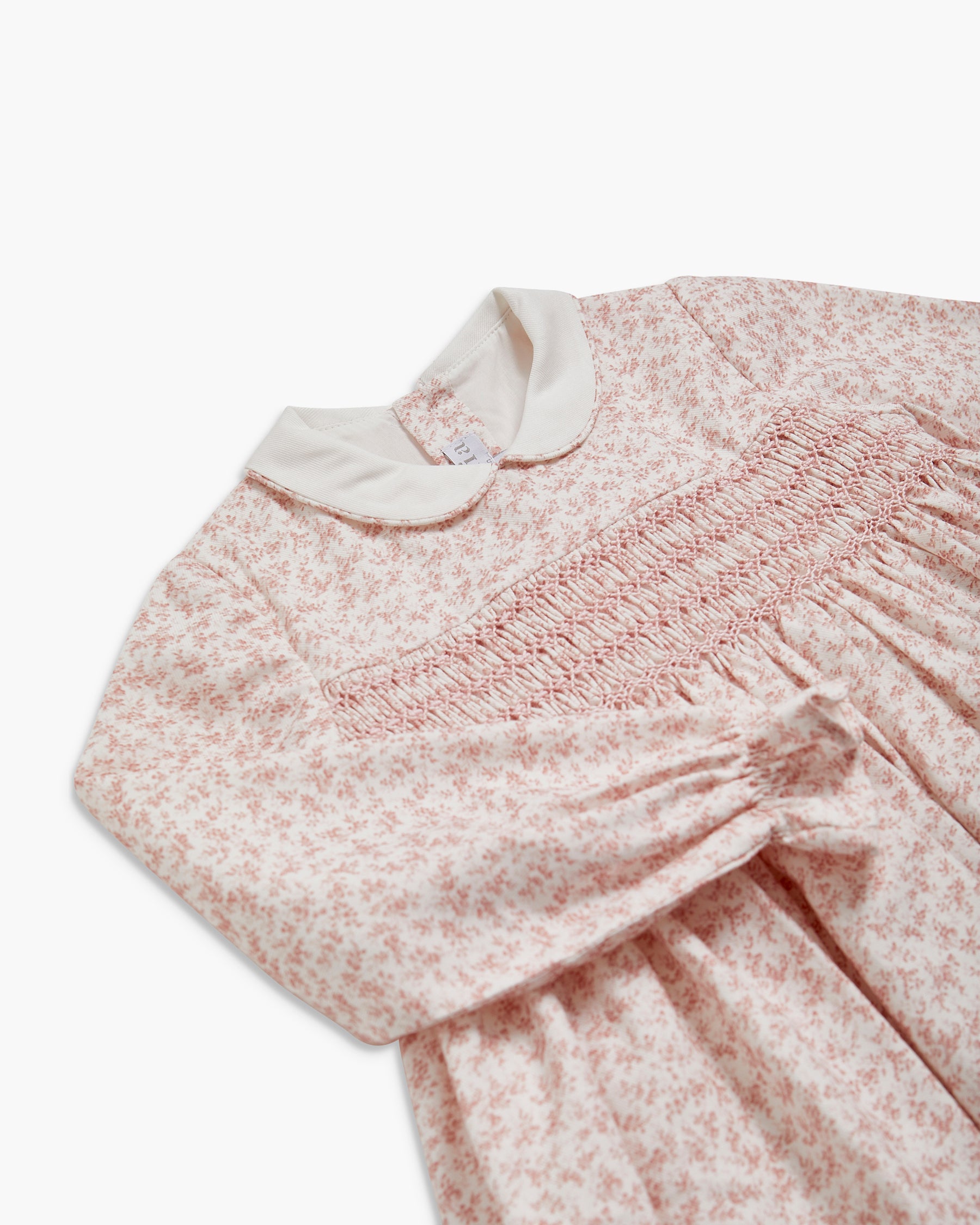 Floral dress with long sleeves on a white background