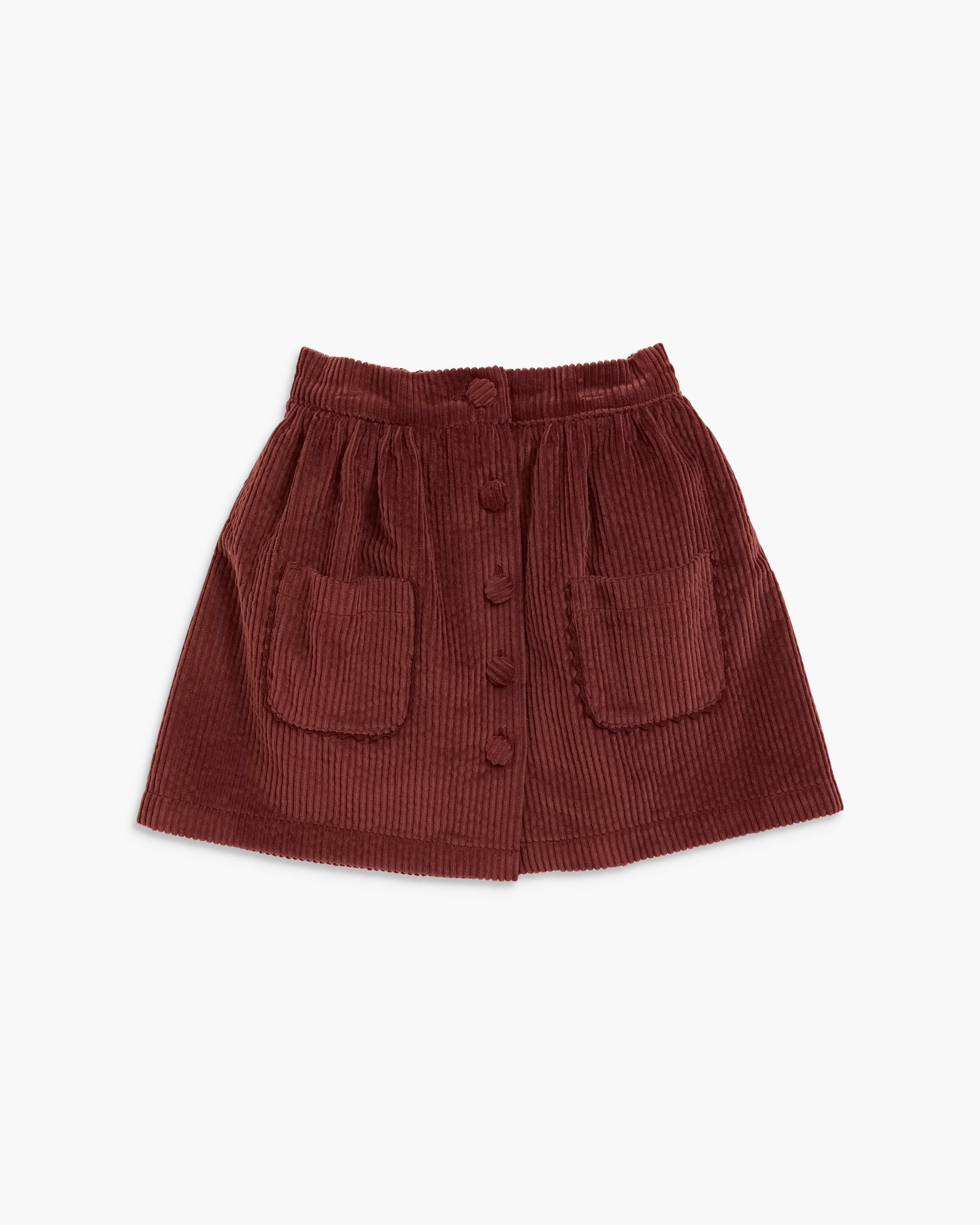 A dark reddish-brown corduroy mini skirt with a button-up front and two front patch pockets, shown flat on a light gray background.