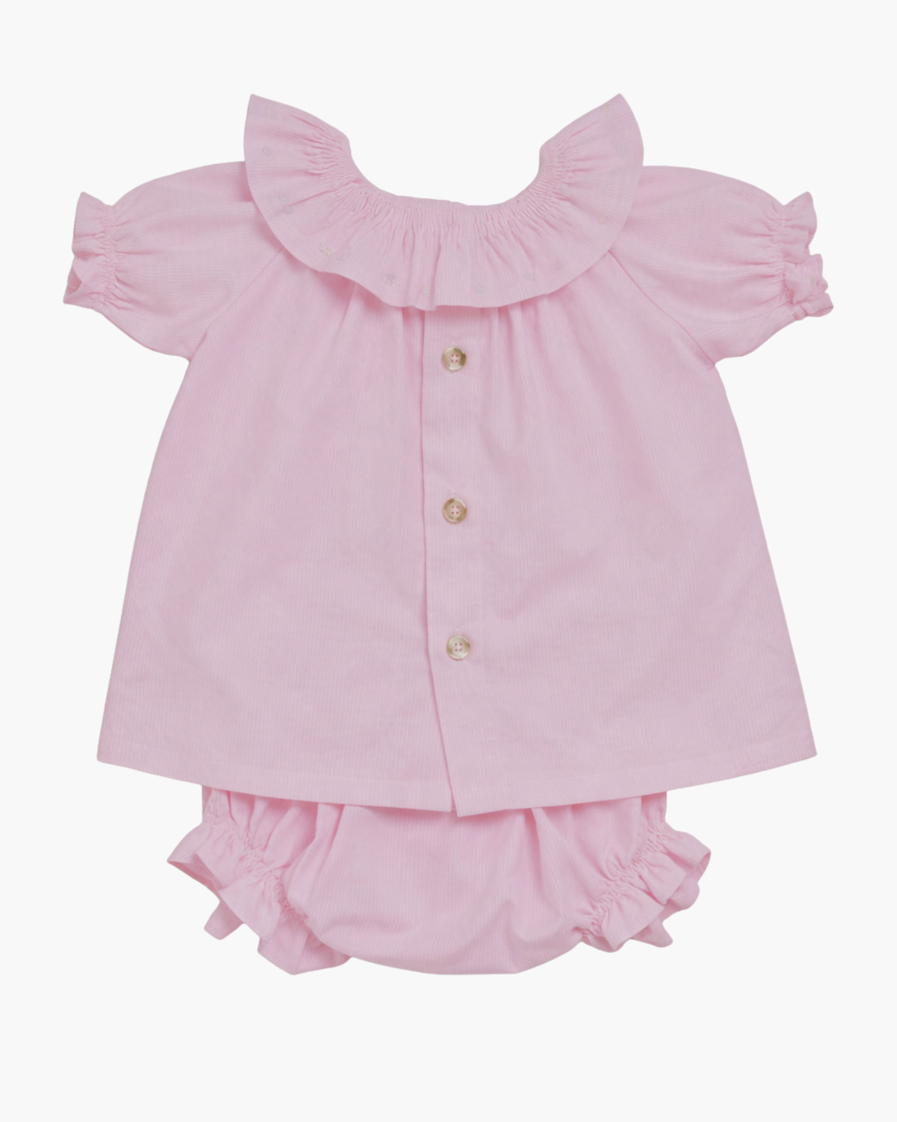 Pink baby outfit with blouse and bloomers on a white background