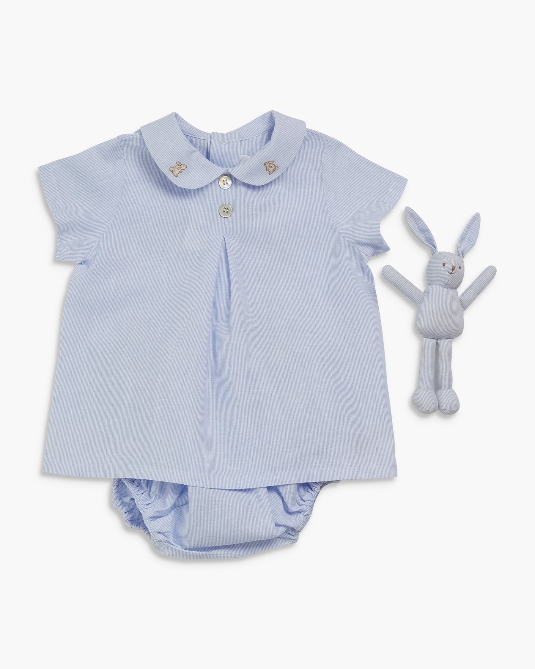Light blue baby outfit with matching rattle on a white background