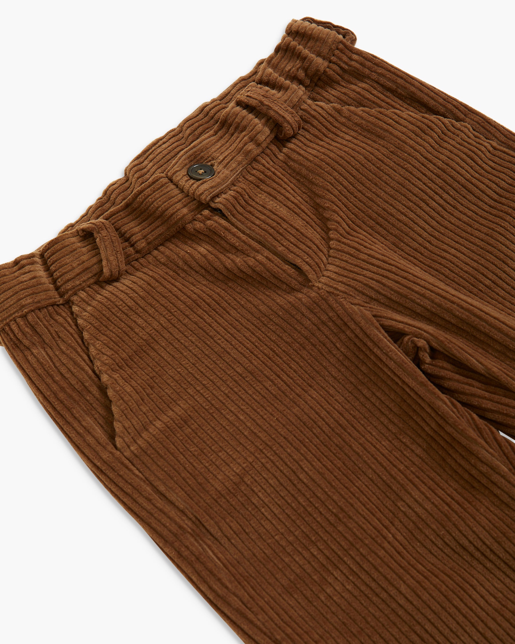 Close-up of brown corduroy trousers showing the waistband, button closure, and ribbed fabric texture on a white background.
