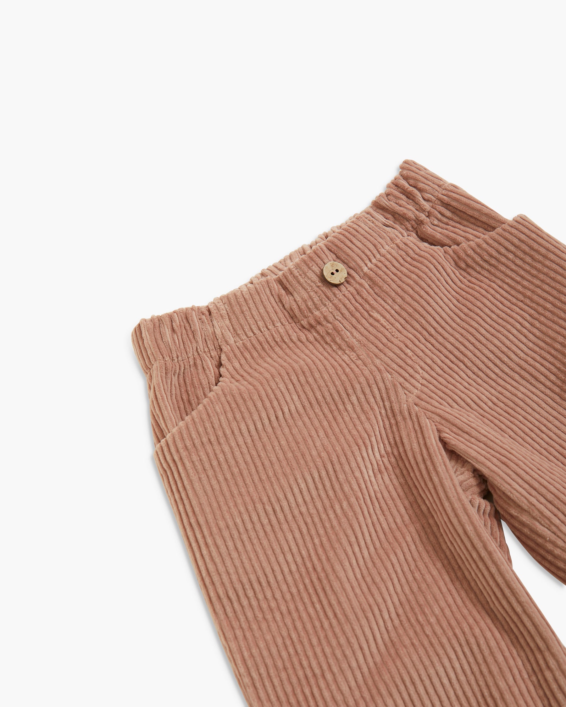 Close-up of a pair of ribbed corduroy pants in a warm taupe-brown color, showing the waistband with a single button and the fabric texture against a plain white background.
