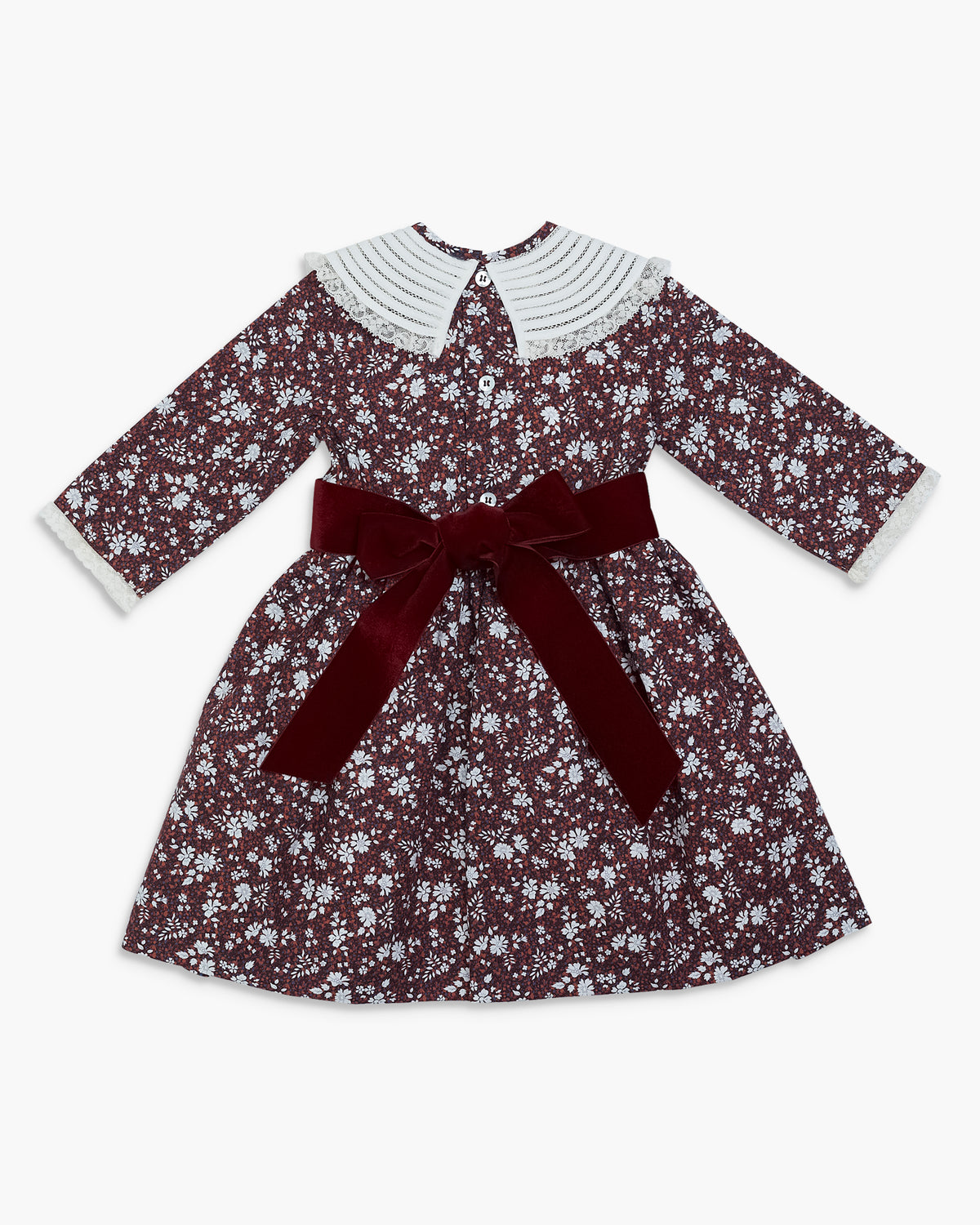 Floral dress with a red belt on a white background