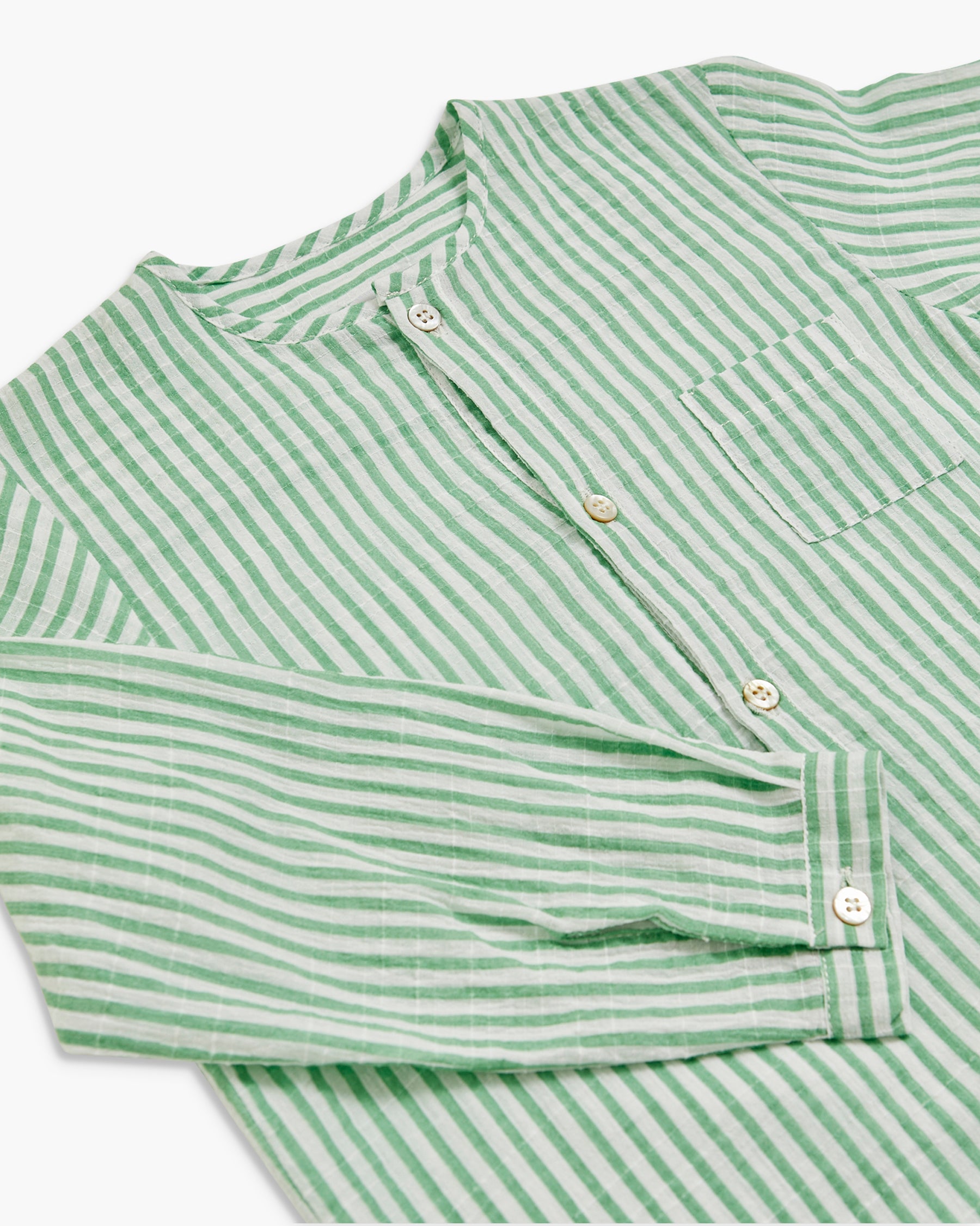 Green and white striped shirt on a white background